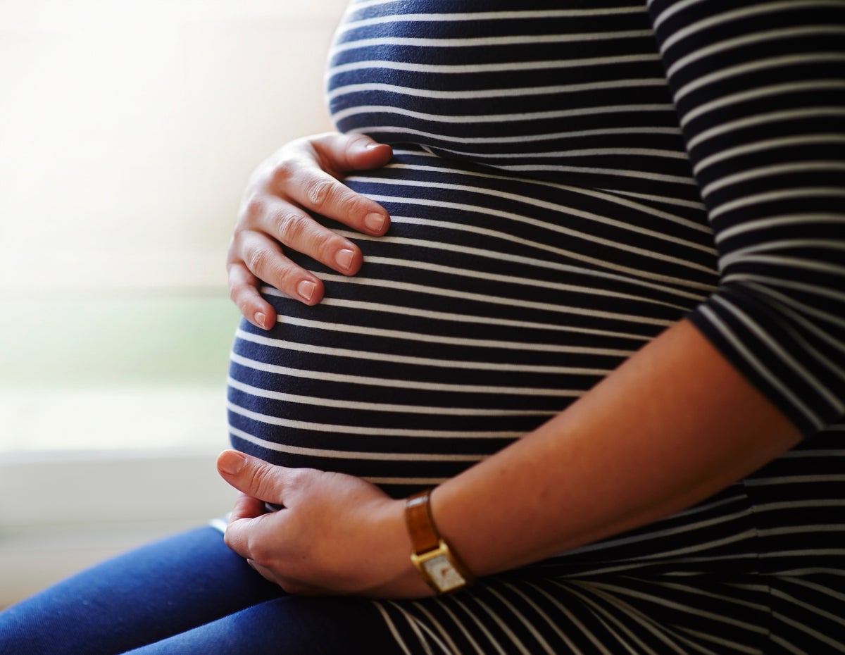 Pregnant woman's midsection.