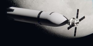 A large, tubelike, pointed spacecraft docked to a smaller canister spacecraft with four black wings.