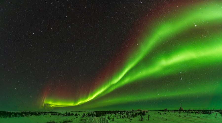 A panorama of a green aurora.