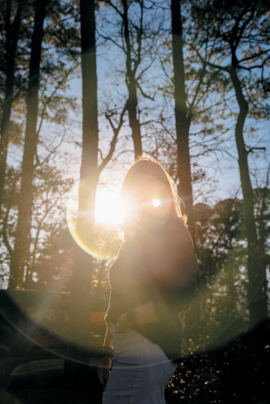 Portrait of Young strolls in the sunshine near her Virginia home