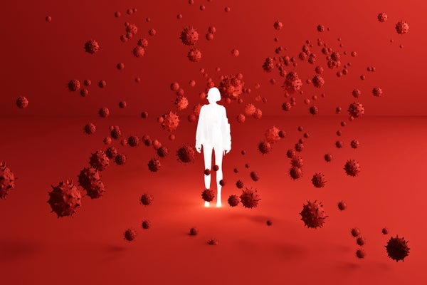 Glowing white human figure surrounding by red coronaviruses in a large red room