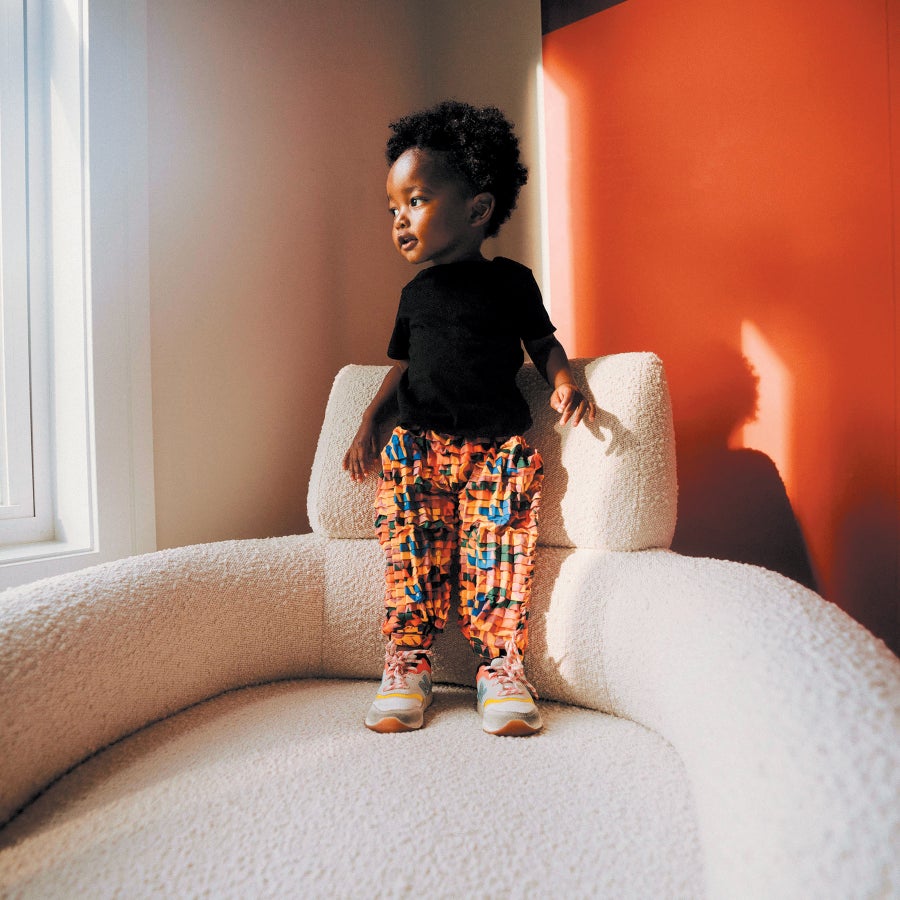 Child Standing on Chair