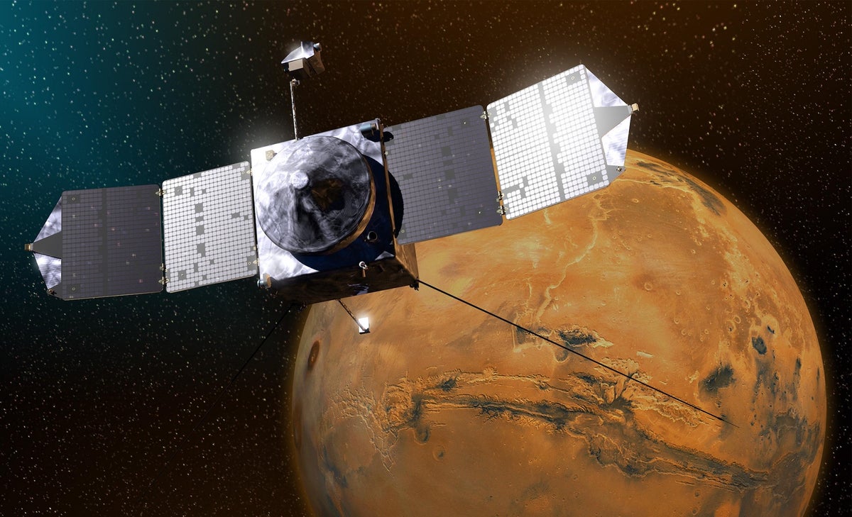 A rendering of a spacecraft with an image of Mars in the background.