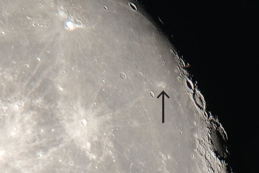 Photograph of the moon showing Reiner Gamma, a “lunar swirl” near the right edge. It was taken using a 20-cm telescope and a phone camera.