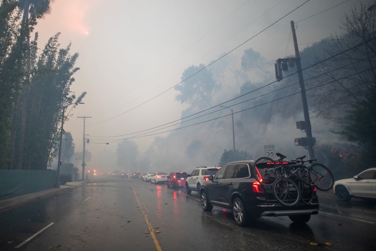 Cars evacuating through heavy smoke