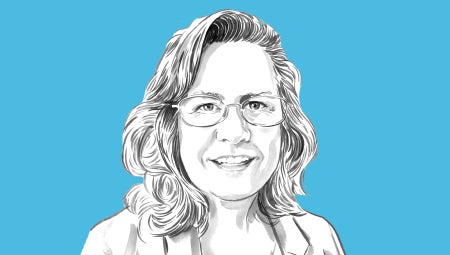 Portrait of Jen Roberts against a blue background