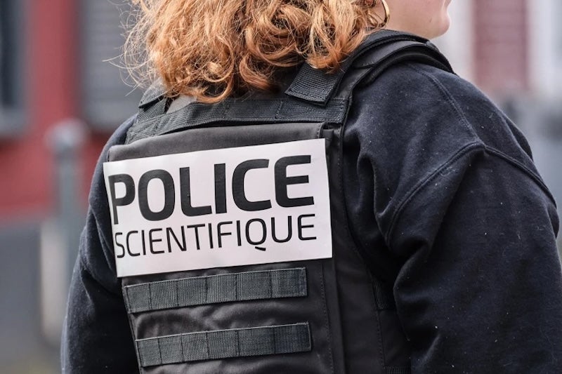 The back of a French police officer.