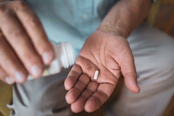 Single pill in man's hand