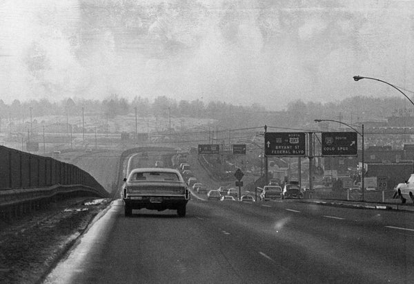 A black-and-white photo of cars on a highway in 1974