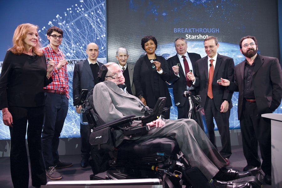 Multiple people on stage at an event