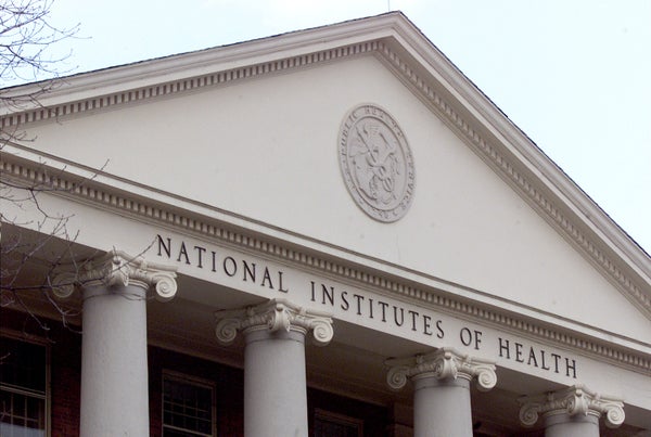 A seal that reads "U.S. Public Health Service" adorns a building on the campus of the National Institutes of Health,