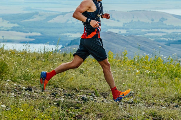 Runner on a mountain trail during race