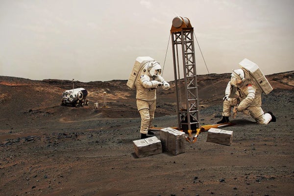 Two astronauts operate drill on red, rocky Martian plain