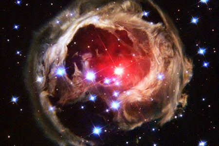 The Hubble Space Telescope captured this view of an expanding halo of light around a distant star, named V838 Monocerotis on February 8, 2004. The illumination of interstellar dust comes from the red supergiant star at the middle of the image, which gave off a flashbulb-like pulse of light in 2002.