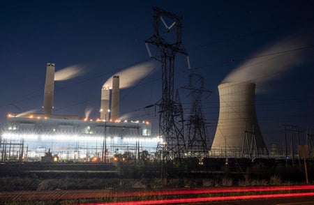 Steam rises from the Miller coal Power Plant.