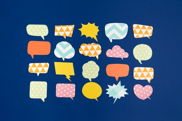Colorful speech bubbles with different patterns sit as cutouts on a solid background