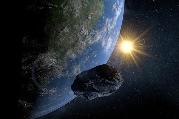 Small Rock -Asteroid passes very close to Planet Earth with the sun in the background