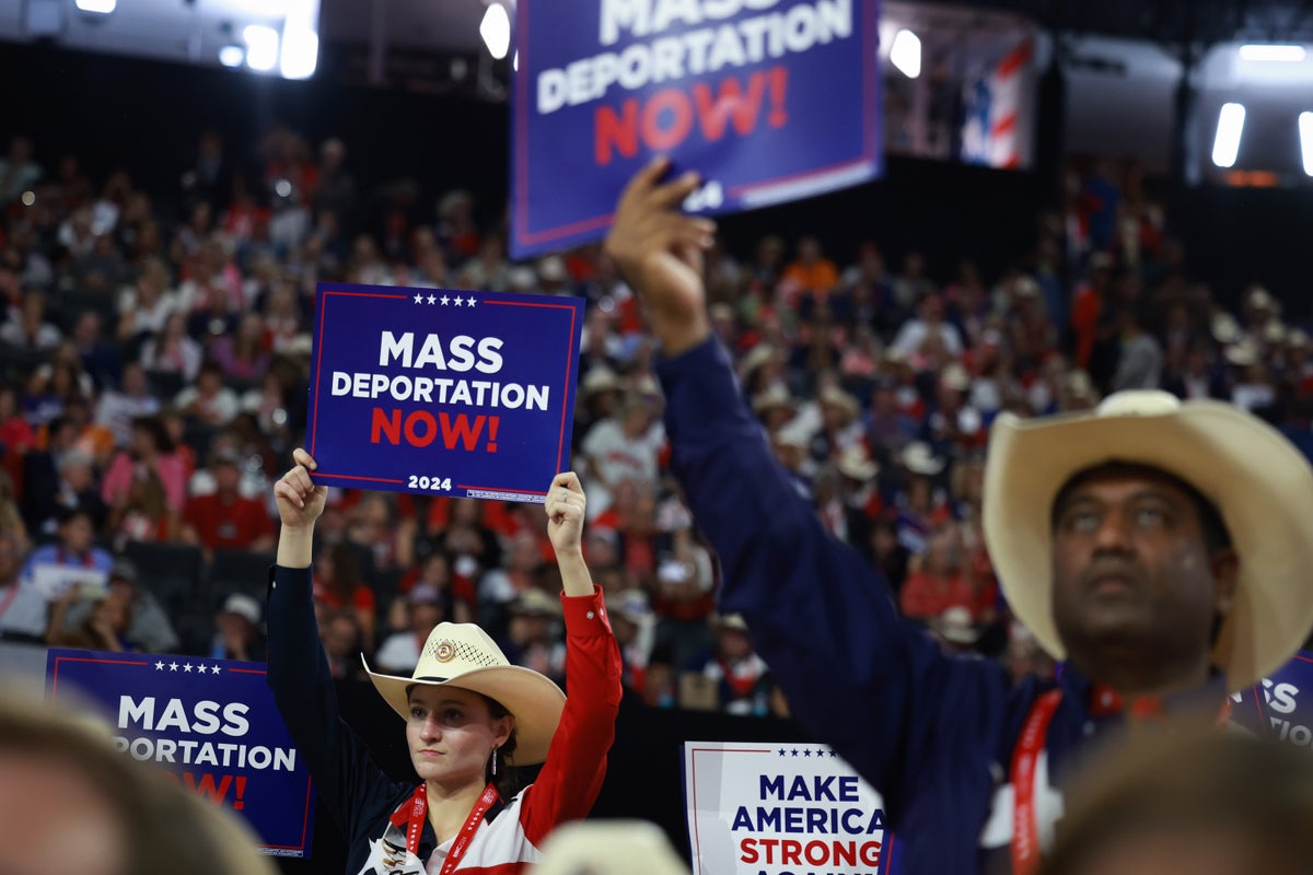 Some attendees of the Republican National Convention hold 