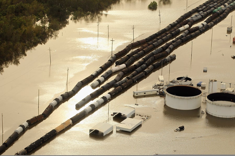 Oil containers and railroad cars sit in Hurricane Isaac's flood waters