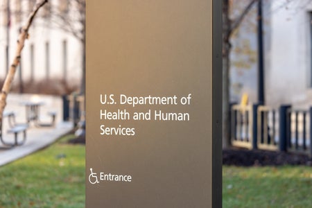 An outdoor sign reading "U.S. Department of Health and Human Services"