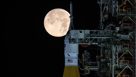 A full Moon is seen shining over NASA’s SLS (Space Launch System) and Orion spacecraft