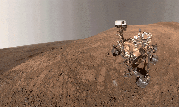 NASA's Perseverance rover swivels its head against an austere Martian backdrop