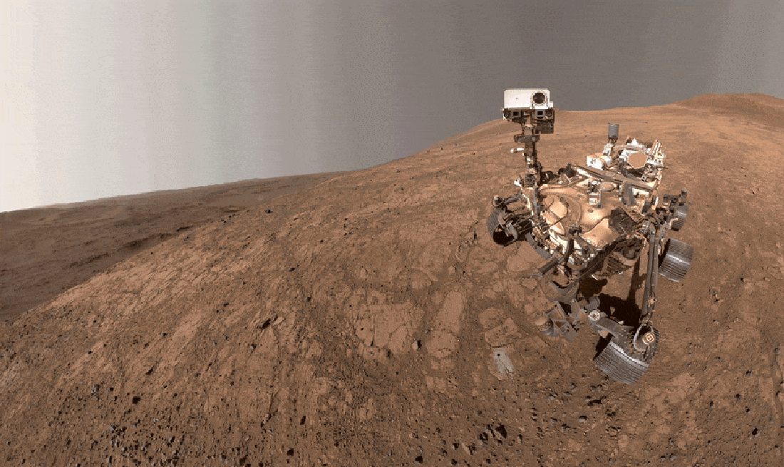 NASA's Perseverance rover swivels its head against an austere Martian backdrop
