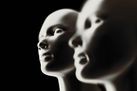 Two computer generated heads - one on the right in foreground out of focus with bokeh effect, second on the left in center of frame in focus