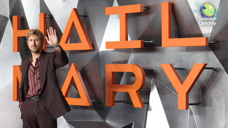 An image of actor Ryan Gosling with his hand up at the World Premiere of Project Hail Mary