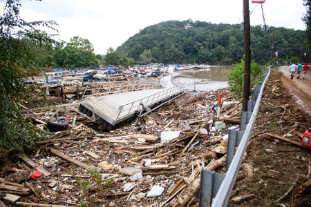 Debris piled near destroyed bridge