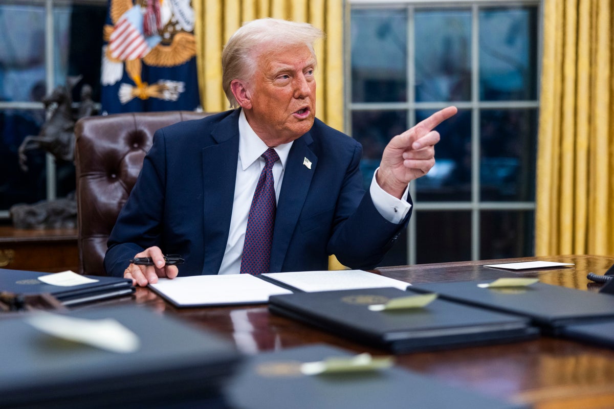 US President Donald Trump speaks while signing executive orders in the Oval Office.