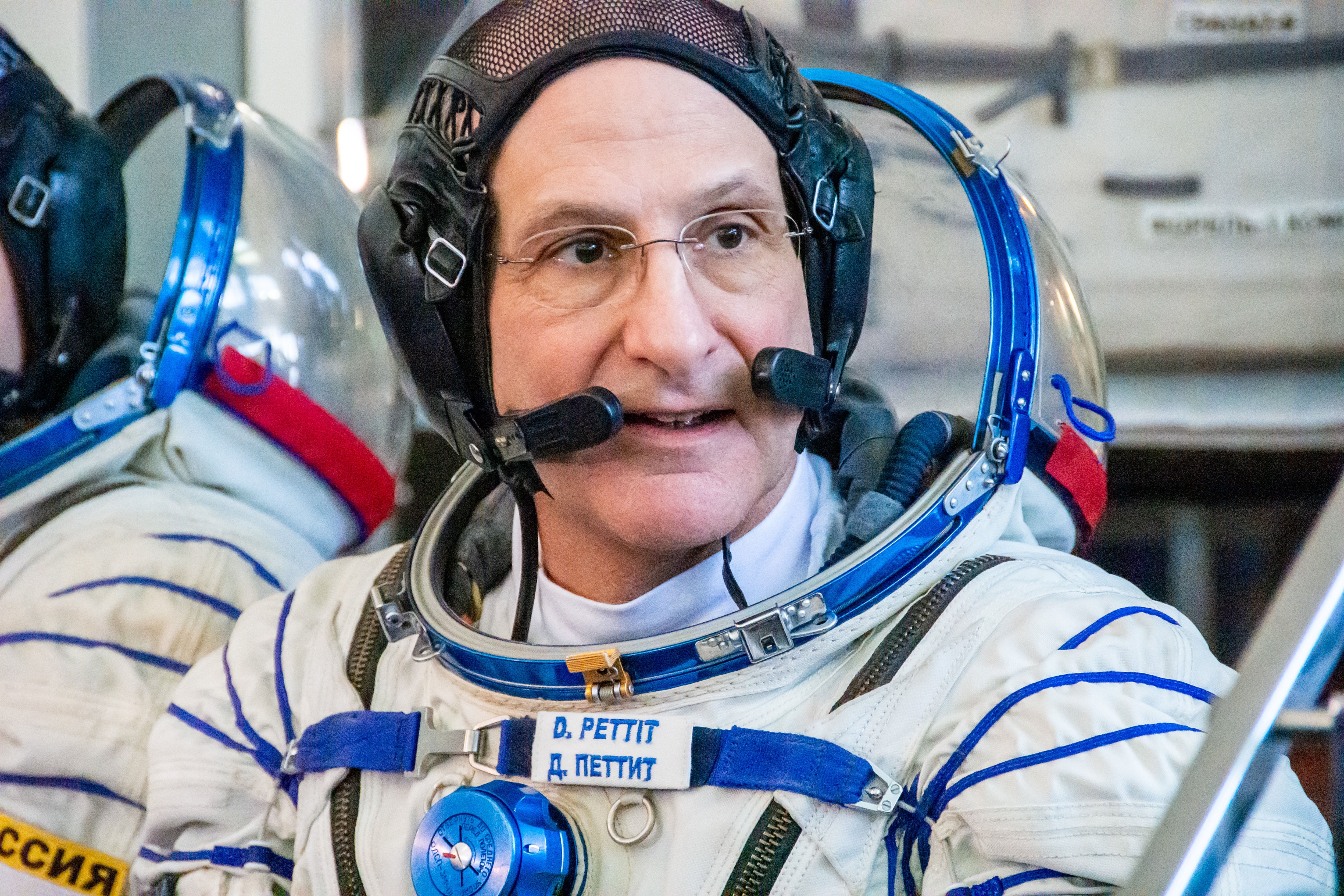 Candid photograph of Don Pettit from NASA, pictured in his Sokol launch and entry suit