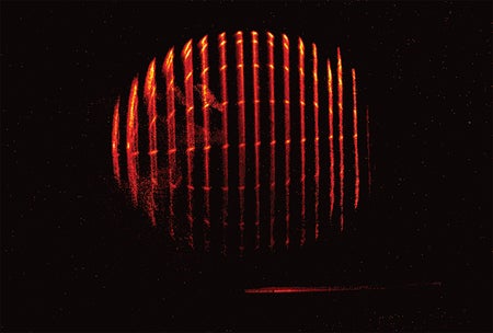 Video shows vertical slices of red light revealed in succession on a black background. A slightly elongated and rotated spherical shape emerges and then disappears.
