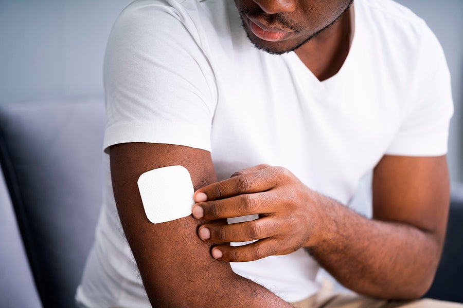 Man wearing a smoking patch on arm