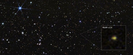 NASA’s James Webb Space Telescope shows galaxy MoM-z14 as it appeared in the distant past (a blurry speck) only 280 million years after the universe began in the big bang.