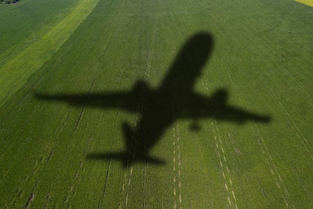 Shadow of the plane on an agricultural field.