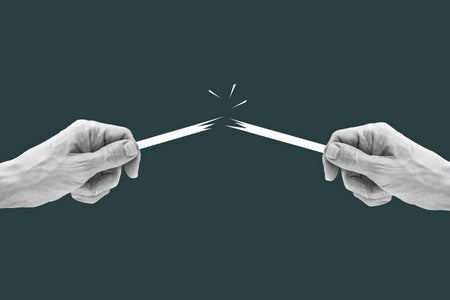 Photo illustration, human hands breaking a stick