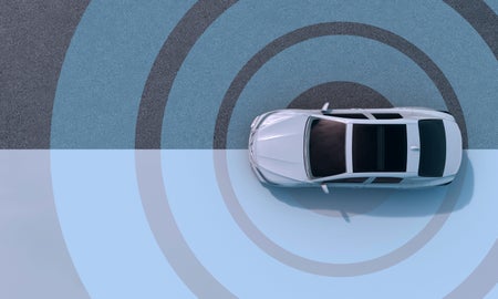 A car parked on the ground with a target design surrounding it
