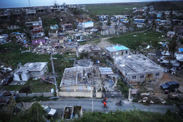 Aerial view of destroyed homes in Puerto Rico after hurricane.