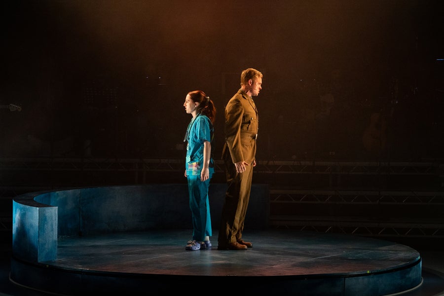 Sir Alexander Fleming and Dr. Jess sing a series of duets on stage.