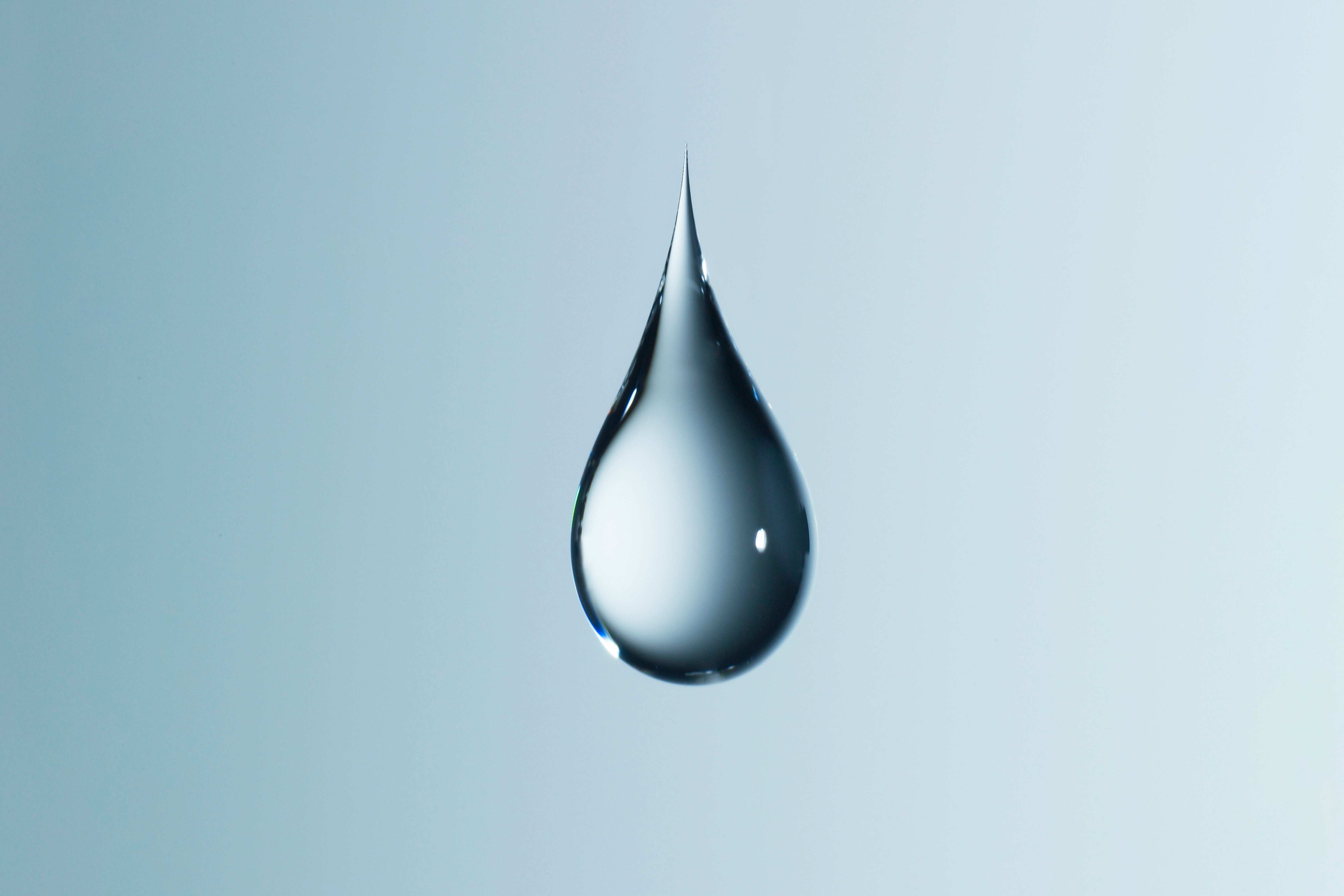 Clear light blue water droplet