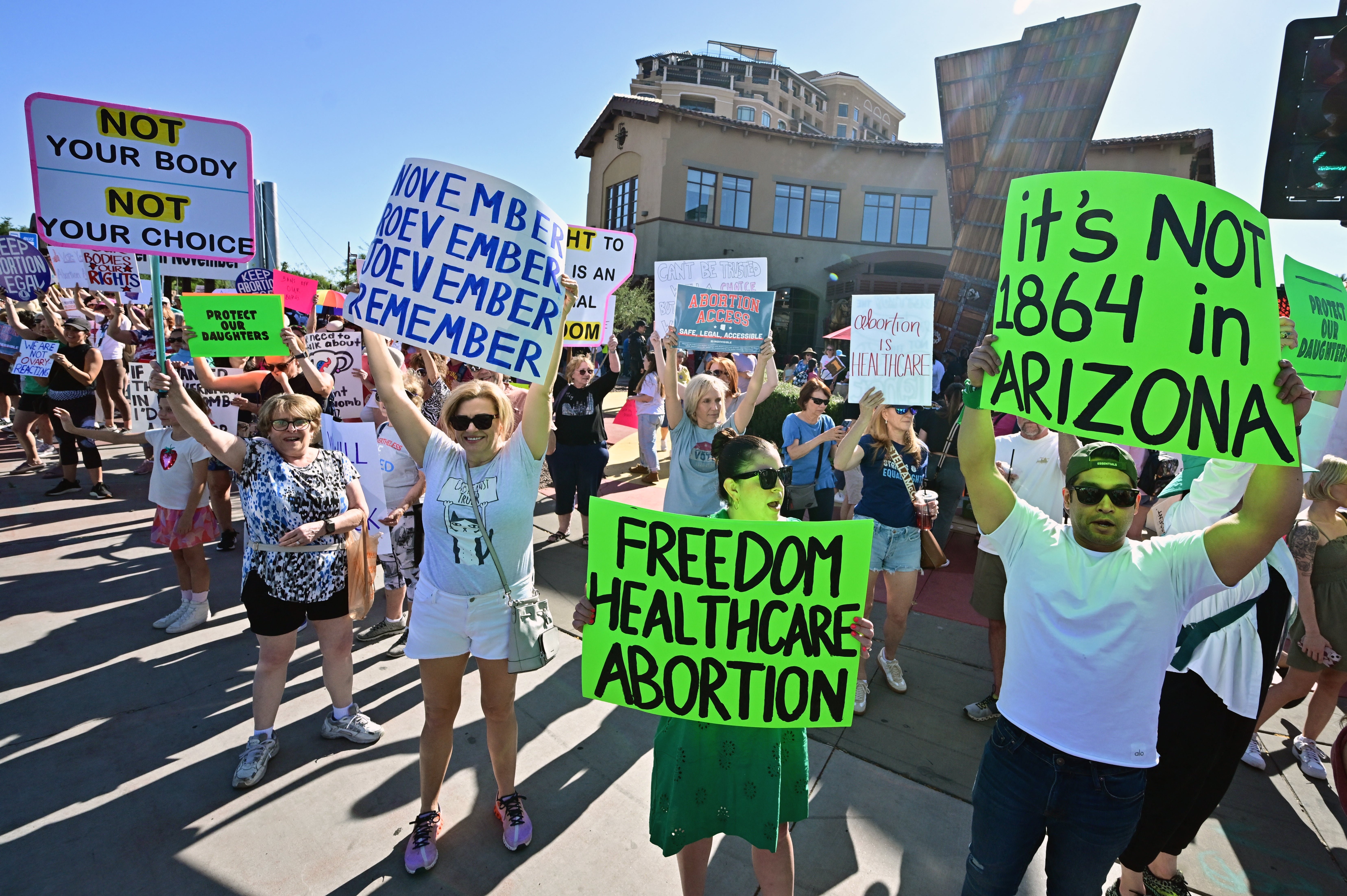 A crowd of people carry pro-abortion signs