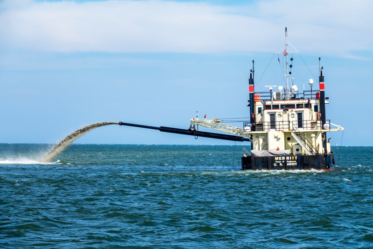 A U.S. Army Corps boat pumps sediment off the North Carolina coast