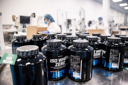 Many black over-the-counter medicine bottles. The only label visible reads "ISO WHEY ZERO."