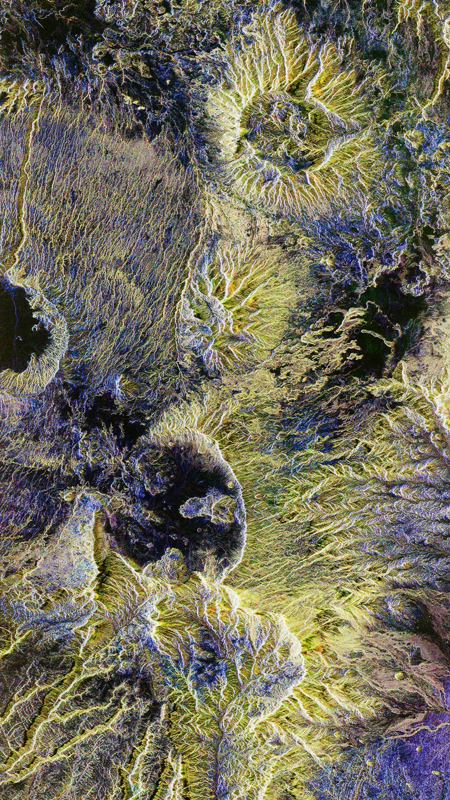 A blue and yellow radar image of the Tibesti mountain range, located in the Sahara desert, in the north of Chad