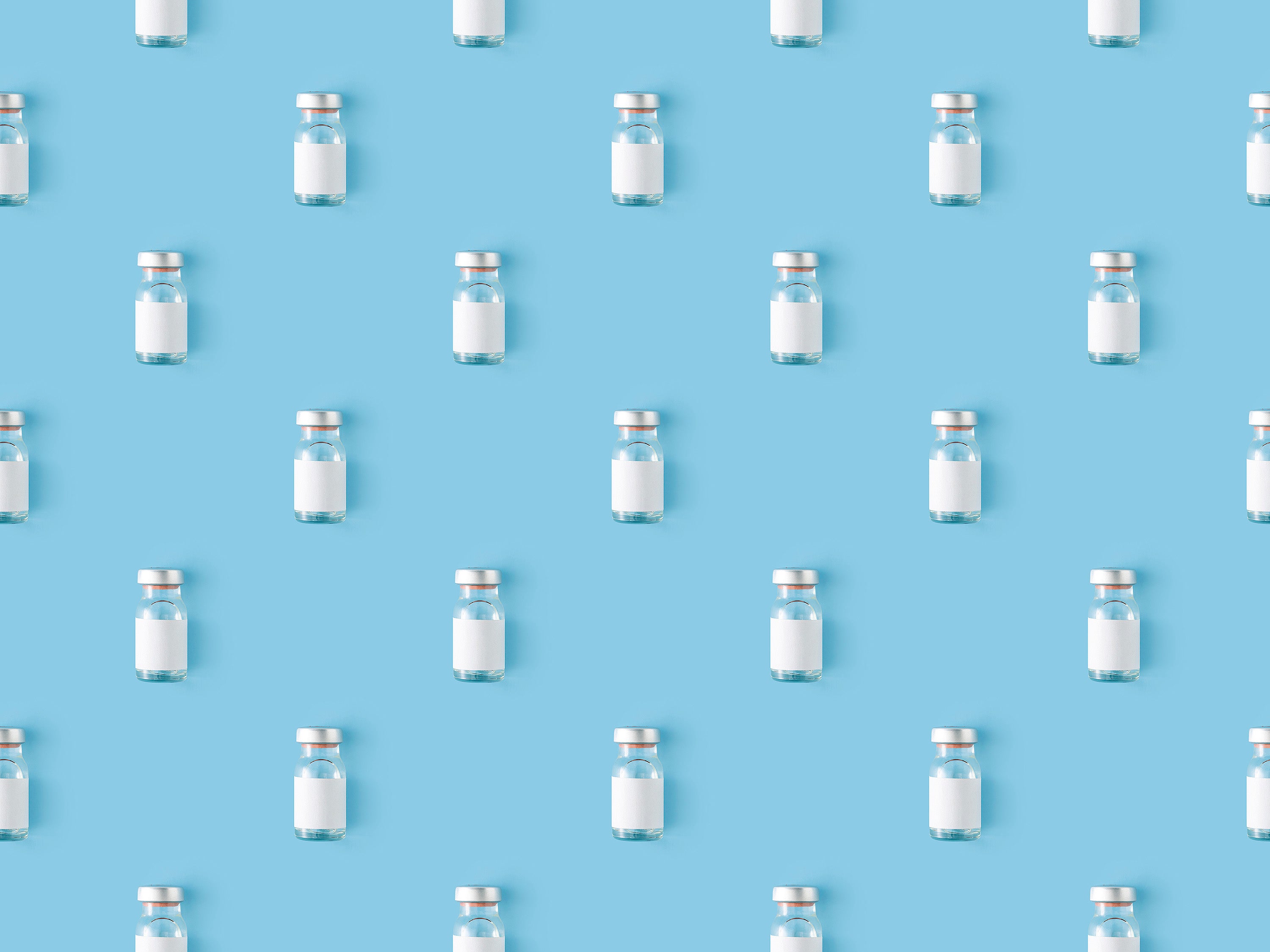 Seamless repetitive vaccine bottle on a blue background