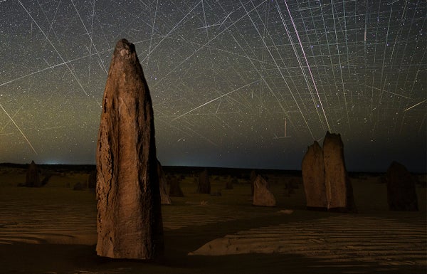 Satellite streaks appear in a photograph taken above the Pinnacles in Nambung National Park, Western Australia.