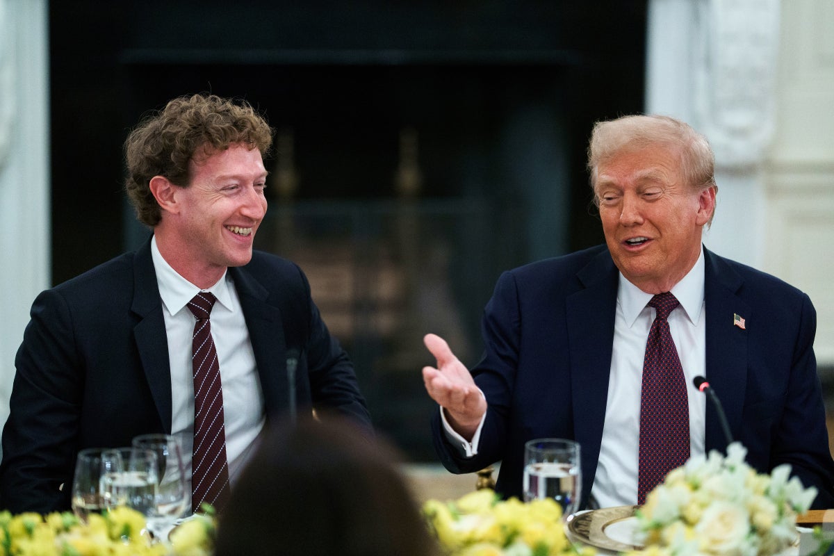 Mark Zuckerberg and President Donald Trump laugh during a dinner with tech leaders at the White House on September 4, 2025.