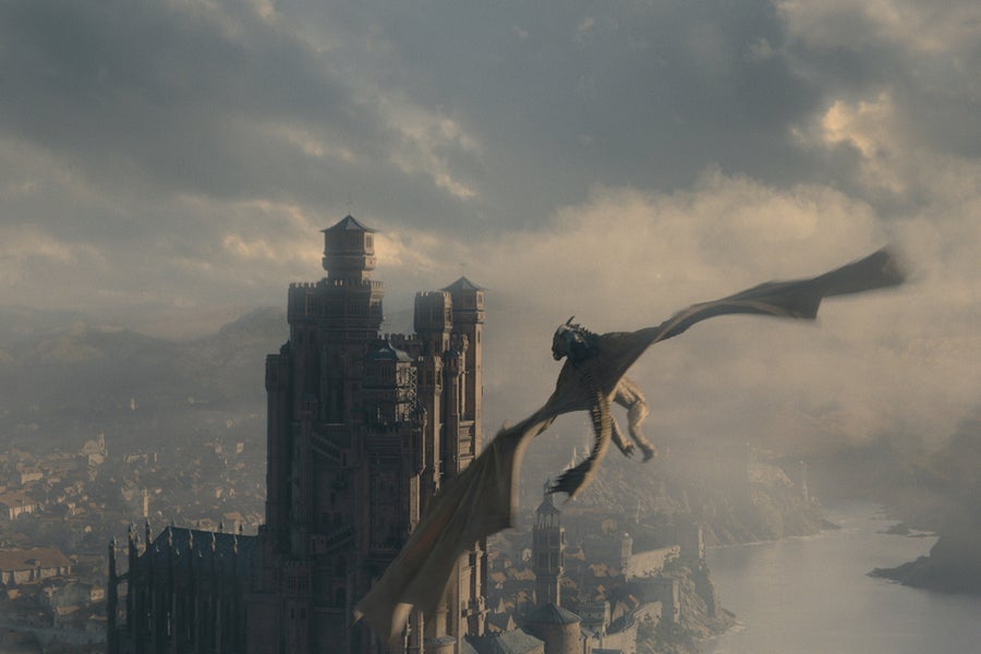 A dragon is shown flying over Kings Landing from the HBO series House of the Dragon
