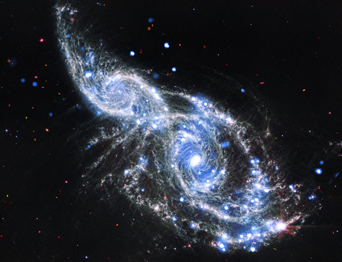 NASA Telescopes Capture Colliding Spiral Galaxies In Sparkling Detail NASA Telescopes Capture Colliding Spiral Galaxies In Sparkling Detail